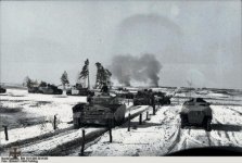 Panzer IV and SPWs moving through snowy winter landscape_2.jpg