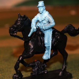 Mounted cavalry trooper shooting to left