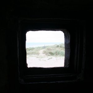 Utah beach looking along the beach from pillbox on the sea wall by the road.