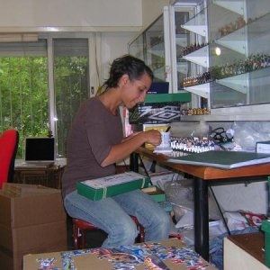 Lucila preparing figures for shipping