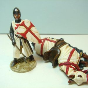 knight templar figure with dead horse