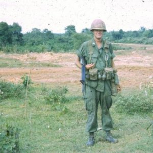 Recon pltn soldier in usual kit, taken along the CAMBODIAN BORDER.