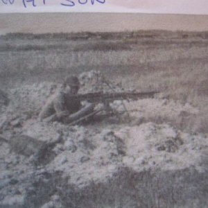 "Machine gun" John Watson,A master of the M60,In his hole near the Cambodian border.