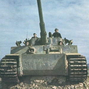 My opinion:  Tiger I, possibly Initial Production 1942 (headlamps missing, though)

http://images.google.com/imgres?imgurl=http://upload.wikimedia.org