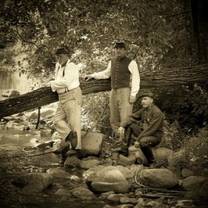 Some of the boys cooling near a creek at Conrad's store.