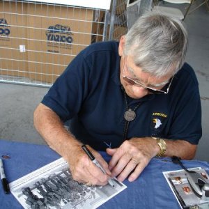 Forrest Guth signing a photo for my collection