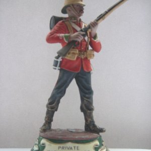 Private Marching 24th Regt of Foot 1879. This version was painted by Betty Stadden and is featured on a green base.