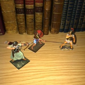 Made in St. Petersburg: Greek,  Persian and Sea People figures having a tussle in bookcase