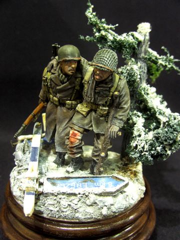 Battle of the Bulge : Village of Grandmenil dec 1944 
At the crossroad leading towards the villages of Erezée, Manay and Bomal two US soldiers are los