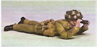 bz09 Officer lying prone viewing field with Binoculars.