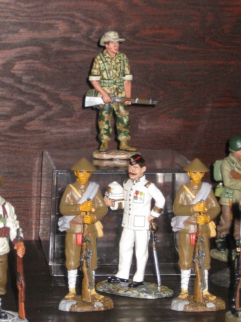 FFL 1950s Vietnam, above. Center FFL early 20th century in white uniform, flanked to Annamite soldiers.