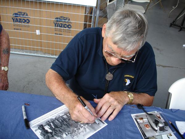 Forrest Guth signing a photo for my collection