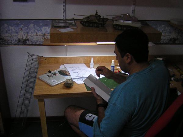 Gabriel Mileto checking his sources for his latest Honour Bound vehicle sculpt