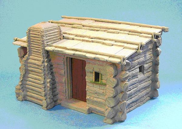 John also sent us a picture of the finished Log Cabin, which he and the “Frog” were working on during our visit!