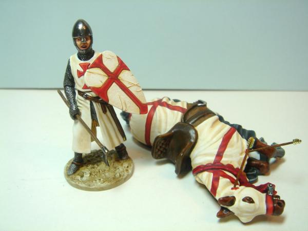 knight templar figure with dead horse