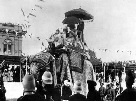 Lord and Lady Curzon on elephant; Coronation Durbar, Delhi, 1903