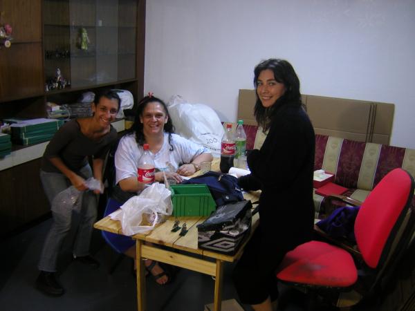 Lucila, Ana and Beau Geste painting manager Marcela.  Marcela is in charge of painters who paint off-site.