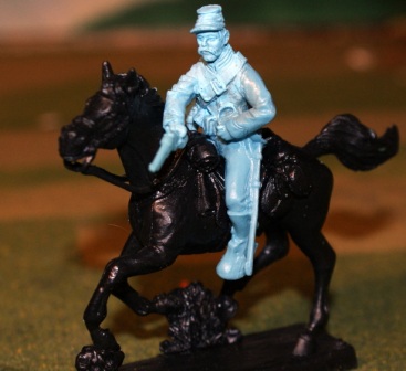 Mounted cavalry trooper shooting to left