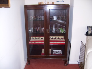 My Main Display Cabinet, converted this from a Mahogany Hall Wardrobe been in family for years, just took the panels out of the doors, put laminated g