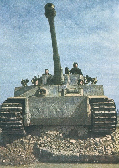 My opinion:  Tiger I, possibly Initial Production 1942 (headlamps missing, though)

http://images.google.com/imgres?imgurl=http://upload.wikimedia.org