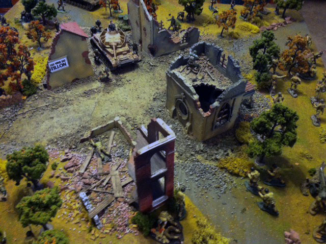 n10 - Some 29th Division troops advancing and view of center of village.