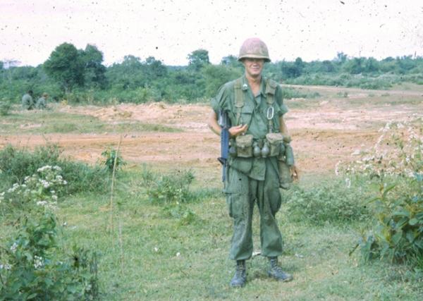 Recon pltn soldier in usual kit, taken along the CAMBODIAN BORDER.