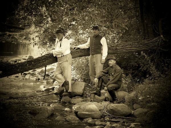 Some of the boys cooling near a creek at Conrad's store.