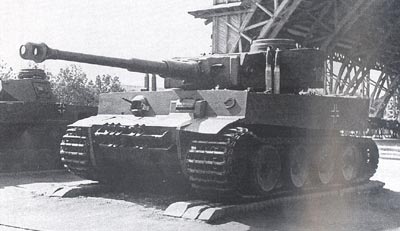 The general view of Tiger tank "#100". Moscow, the captured weapons exhibition, June 1943. 88-mm tank KwK gun shells mounted on the roof of the hull. 