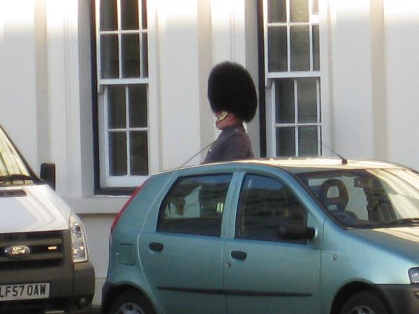 The lone bugler--seemed kind of odd to have him penned in behind parked cars