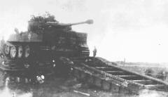 This poor quality picture may show one of the first Tiger I tanks to be issued for combat. Heavy Panzer Battalion 502 had some Tigers in its first Com