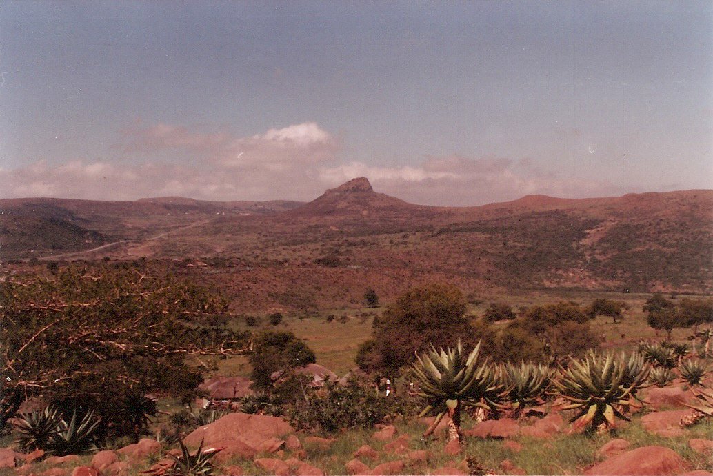 Ultimate holiday snap: Isandlwana from the west.   Rorke's Drift road visible on left.