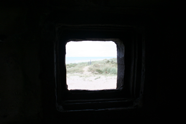 Utah beach looking along the beach from pillbox on the sea wall by the road.